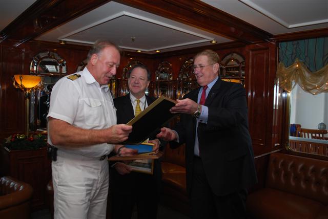 From left, Capt. Andreas Greulich exchanges plaques with Tommy Westfeldt, Chairman of the Board of Commissioners of the Port of New Orleans and Gary LaGrange, President and CEO of the Port of New Orleans to commemorate the Deutschland's maiden call to New Orleans.