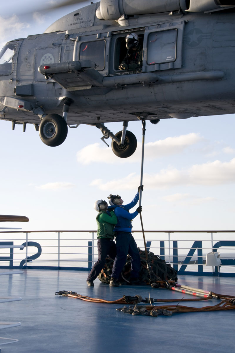 The U.S. Navy and Coast Guard assist on the Carnival Splendor.