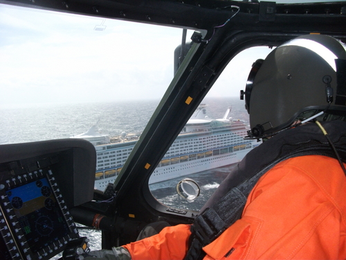 Coast Guard MH-60 Jayhawk helicopter pilot prepares to approach the cruise ship Explorer of the Seas 230 miles east of Cape Henry, Va. for a medevac of a 59-year-old women, March 11, 2011. Coast Guard Air Station Elizabeth City, N.C. responded by sending the helicopter crew and a C-130 aircrew. U.S. Coast Guard photo by Petty Officer 2nd Class Richard Fertig. 