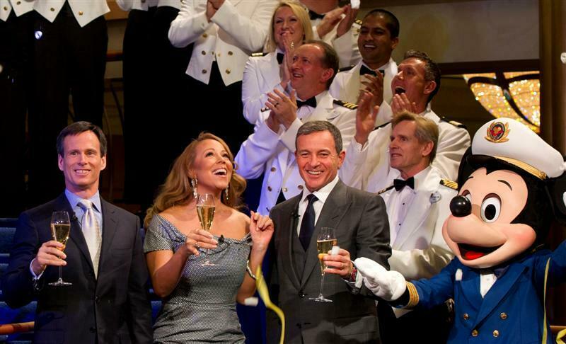 Singer Mariah Carey joins Walt Disney Company President and CEO Robert A. Iger (right), Walt Disney Parks and Resorts Chairman Thomas O. Staggs and Mickey Mouse for the christening of the newest ship of Disney Cruise Line, the Disney Fantasy, in New York City, on March 1, 2012. In a maritime tradition, the award-winning recording artist served as godmother for the 4,000-passenger Disney Fantasy, which sails to her home port of Port Canaveral, Fla. later this month to begin seven-night cruises to the Caribbean and Disney's private island, Castaway Cay. (Matt Stroshane/Disney, photographer)
