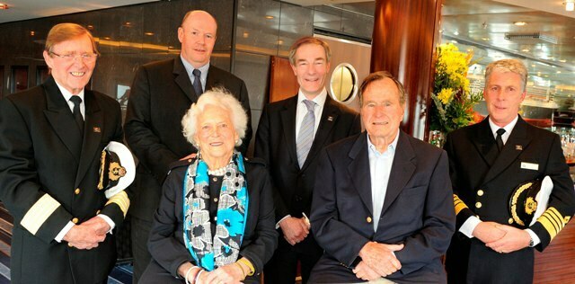 President and Mrs. Bush received a warm welcome aboard Queen Mary 2 from (L-R): Hotel Manager John Duffy, Cunard President Peter Shanks, Carnival UK CEO David Dingle, and Captain Kevin Oprey. 