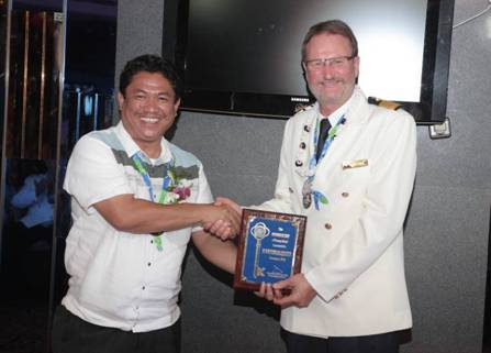 At the welcome ceremony, Honorable Jupiter Gallenero, Sangunian Bayan Member, Municipality of Malay (left) presented the “Key to the City” to Captain Carl J. Nilermark of SuperStar Aquarius (right).