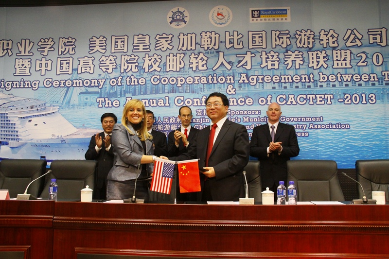 Signing ceremony between TMC and Royal Caribbean. In front, from left: Maria Del Butso, Global Chief Human Resources Officer at Royal Caribbean Cruises and Ma Kui Jun, TMC's president.