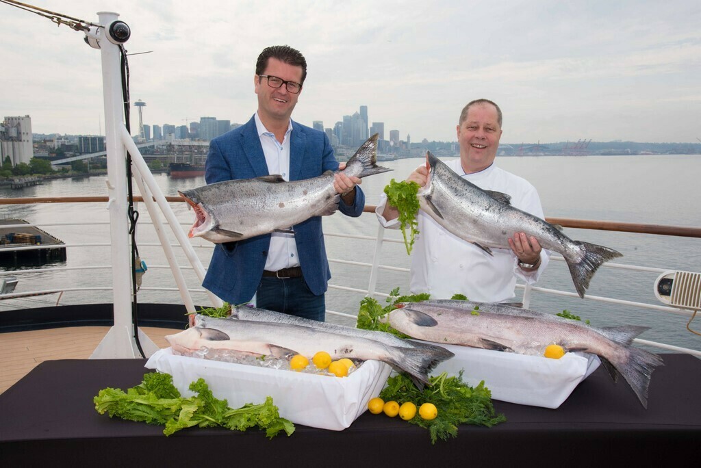 Frits Van Der Werff, vice president, food and beverage experience, and Robert Schuman, fleet executive chef, aboard the Eurodam with Copper River king salmon