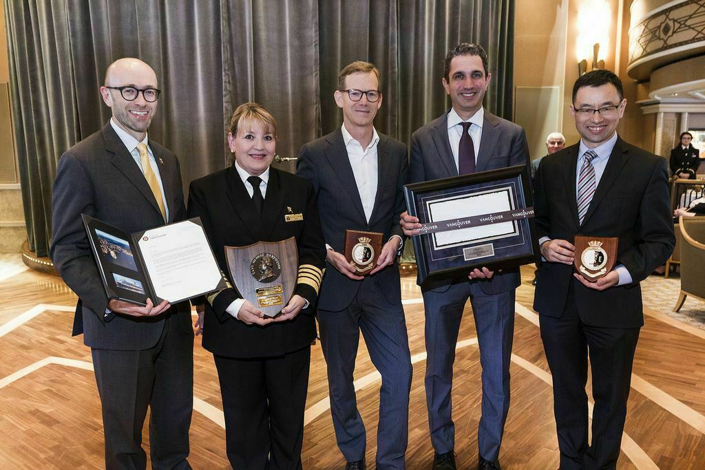 Representatives from Cunard and Vancouver onboard Queen Elizabeth exchange gifts at celebration of ship’s maiden call. Shown from left to right: Simon Palethorpe, President Cunard; Captain Inger Klein Thorhauge; Ty Speer, President and CEO Tourism Vancouver; Josh Leibowitz, Senior Vice President, Cunard North America; and Victor Peng, Chief Financial Officer, Port of Vancouver. (Photo by William Jans for Cunard)
