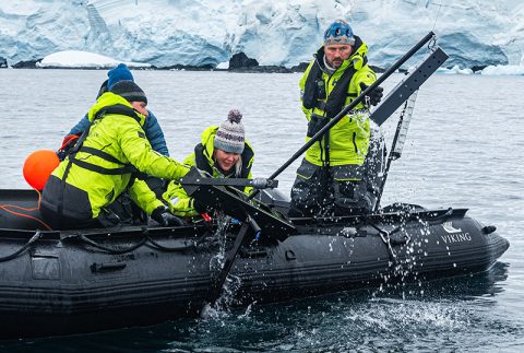Scientists Retrieving Sample
