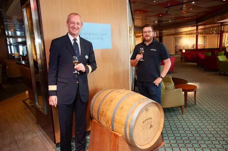 Adnams' Bradley Adnams with Fred. Olsen Cruise Lines Hotel Manager Iain Gibson