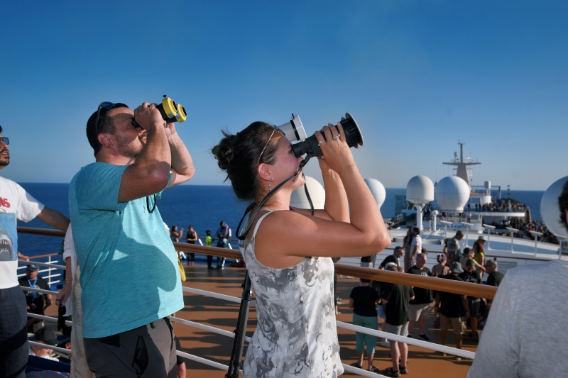 Carnival guests view solar eclipse