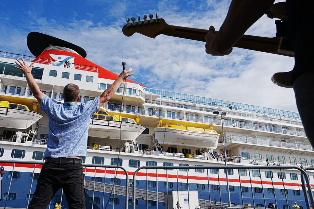Four Worried Men performing on quayside
