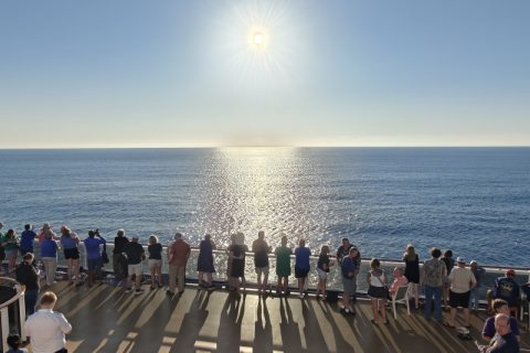 Guests aboard Carnival Legend watch solar eclipse